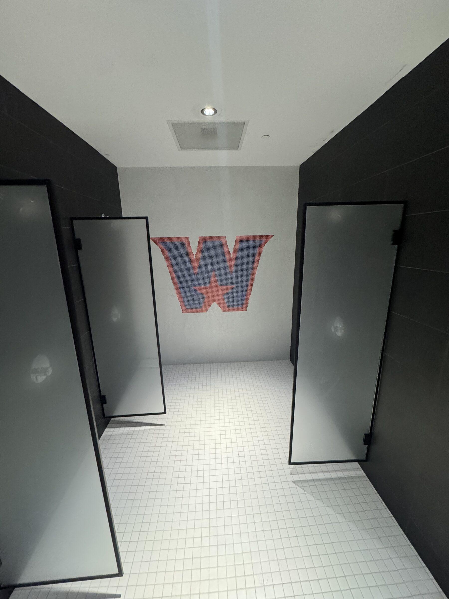 Facility entrance with logo wall, floors freshly scrubbed