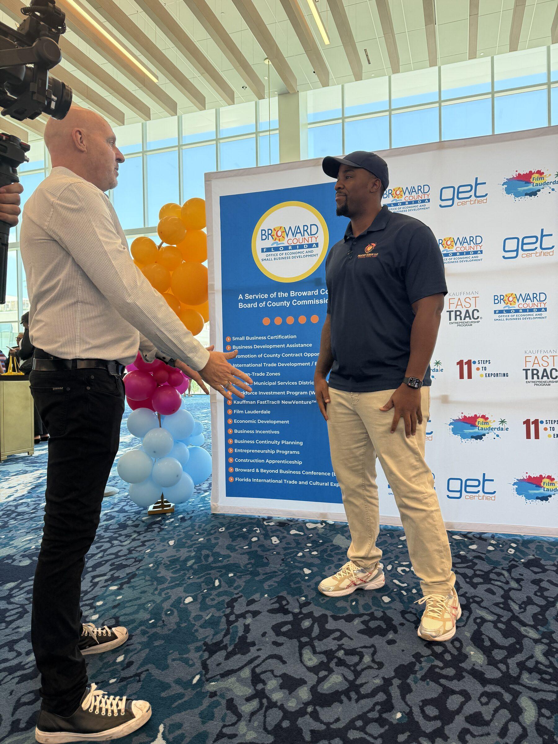 Peachy Klean owner being interviewed at a Broward County small-business event